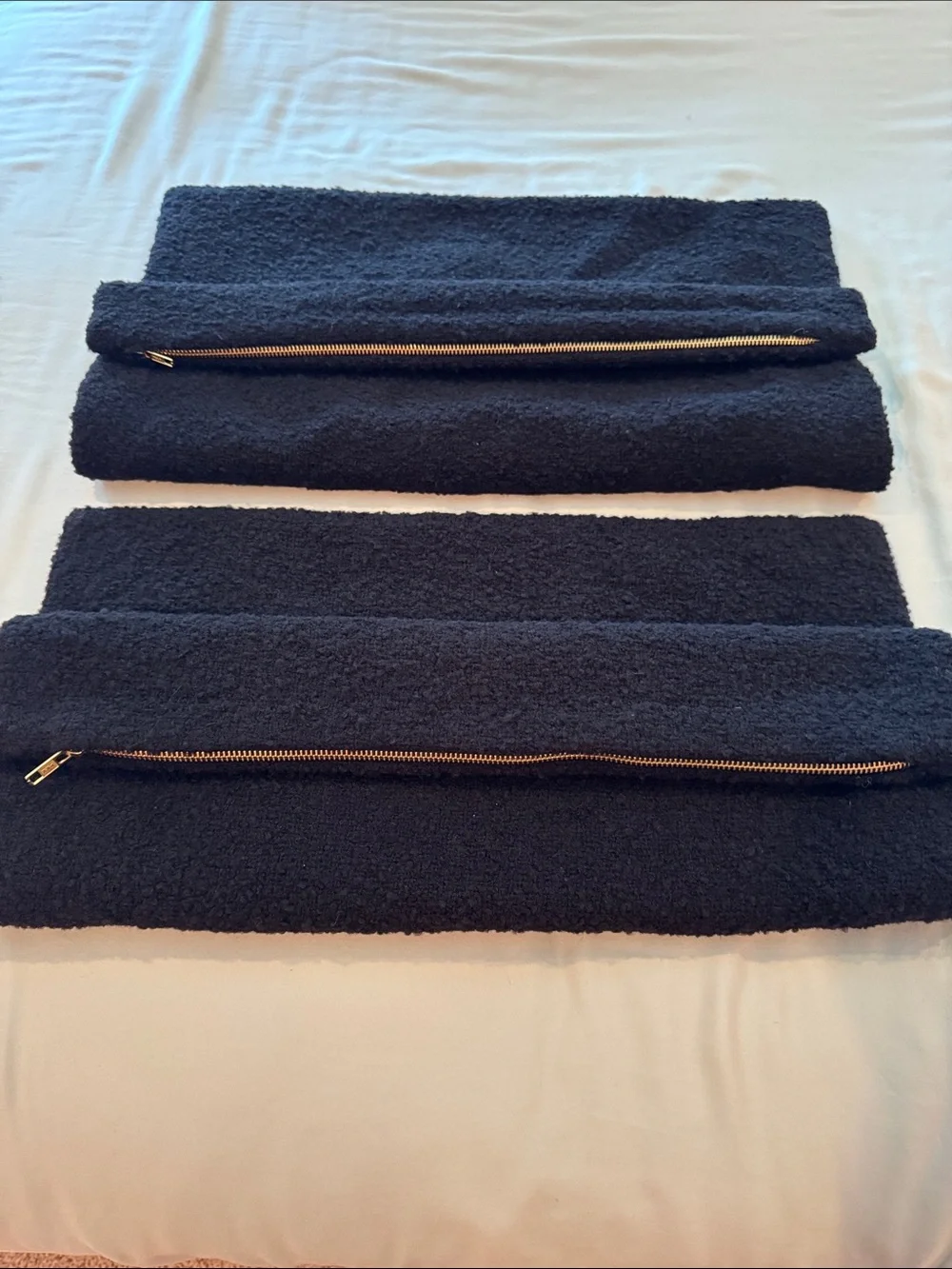 Two CB2 20x20in black boucle pillow covers